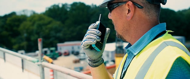 construction worker using walk to send a voice message